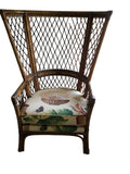 pair of vintage wingback rattan arm chairs