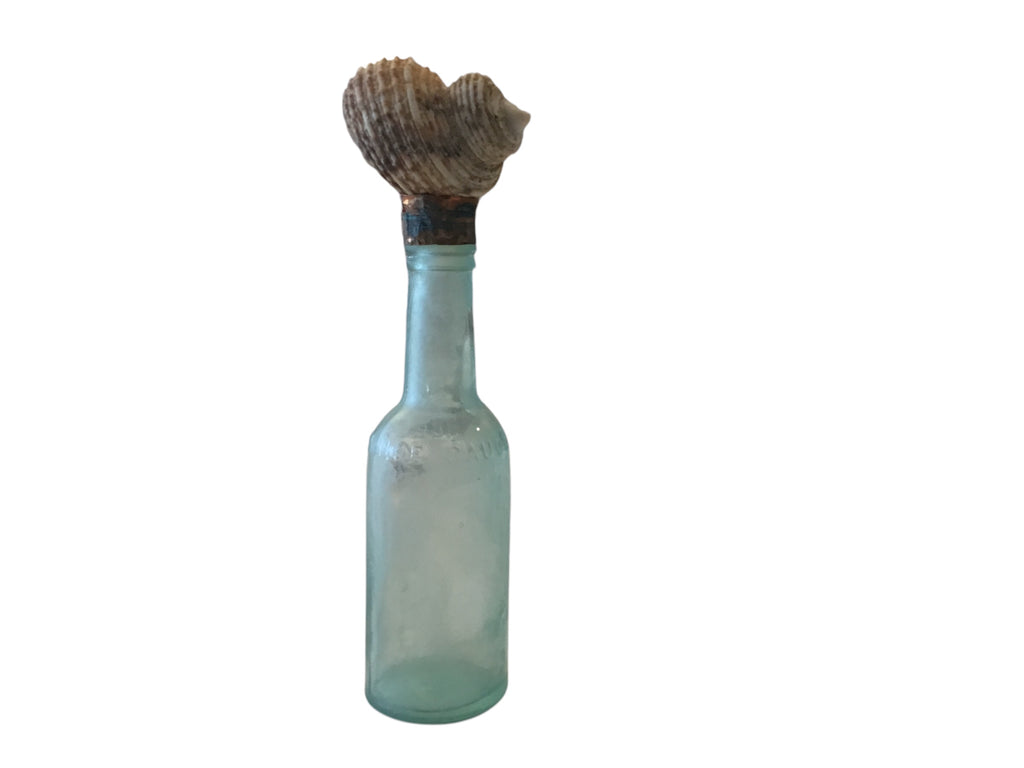 vintage glass medical bottle with snail top