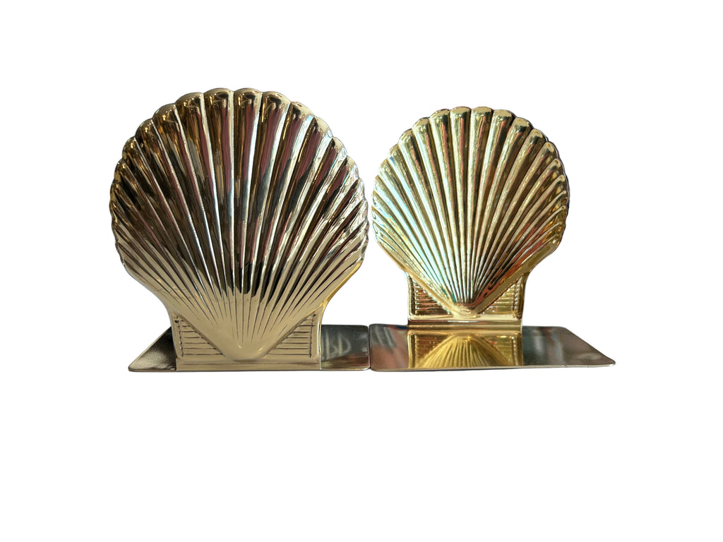 pair of cast brass shell bookends with a lacquerd finish-