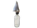 vintage glass medical bottle with conch shell