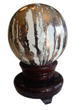 glass sphere on lacquered stand