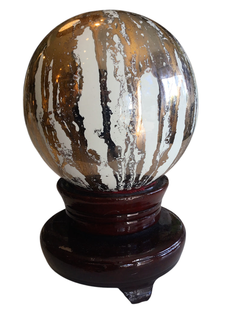 glass sphere on lacquered stand