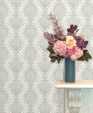 Load image into Gallery viewer, Fern Wallpaper • Beige • Insitu with Pink and purple flowers