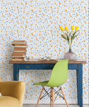 Load image into Gallery viewer, Al Hadiqa Wallpaper • Dainty Floral Design • Desk with books stacked on the left and a lime green chair in front with yellow tulips in a vase on the right side of the desk. • Milton &amp; King USA