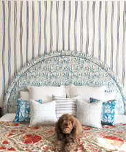 Load image into Gallery viewer, Double Inky Stripe • Striped Wallpaper • Blue Striped Wallpaper Rolls • Georgia MacMillan • Milton &amp; King USA • Bedroom wallpaper showing a bed with a brown dog