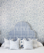 Load image into Gallery viewer, Indigo Garden • Blue Botanical Wallpaper • Floral • Bedroom with plaid blue headboard and white pillows. Milton &amp; King USA
