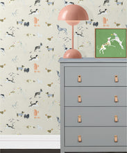 Load image into Gallery viewer, Doggies Wallpaper • Dog Wallpaper • Cream • Inisitu with grey dresser and salmon lamp
