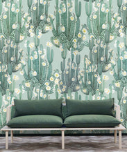 Load image into Gallery viewer, San Pedro Wallpaper Aqua • Cactus Wallpaper • Succulents Wallpaper • Desert Wallpaper Insitu behind sofa with green cushions