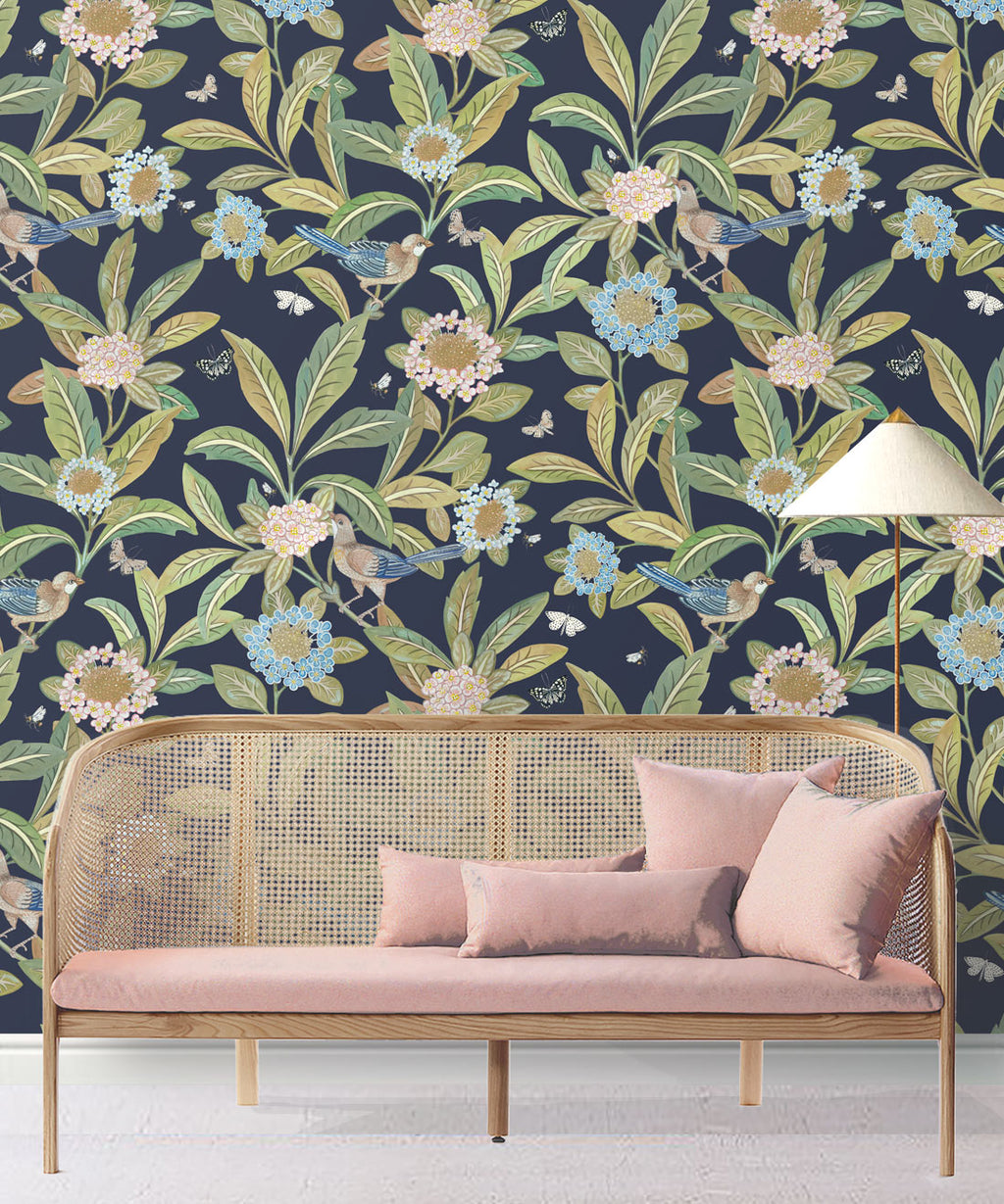 Summer Garden Wallpaper • Navy Wallpaper • Floral Wallpaper Insitu behind pink sofa