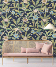Load image into Gallery viewer, Summer Garden Wallpaper • Navy Wallpaper • Floral Wallpaper Insitu behind pink sofa