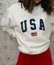 Load image into Gallery viewer, Peonies &amp; Anemones Wallpaper • White Floral Wallpaper • Girl is standing in front of floral wallpaper with a USA sweatshirt on