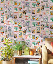 Load image into Gallery viewer, Seed Packets Wallpaper featuring watermelon, carrot, beet, beans, poppy, daisy • Pink • Insitu