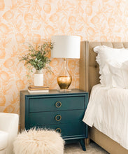 Load image into Gallery viewer, Calypso Wallpaper • Gold wallpaper • Yellow Wallpaper • Pineapple Wallpaper behind a teal bedside dresser