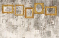 Five ornate antique gold frames on a distressed gray and cream mural background