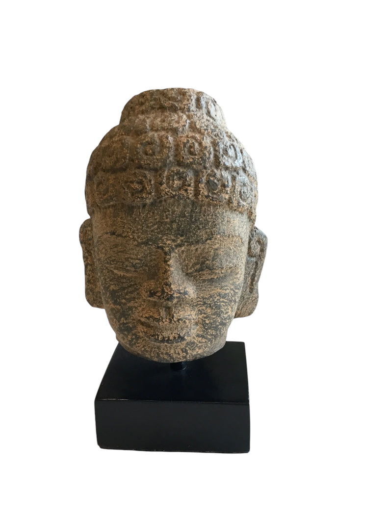 buddah head on stand